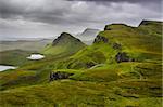 Scenic view of Quiraing mountains with dramatic sky in Scottish highlands, Isle of Skye, United Kingdom