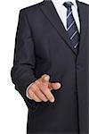 Businessman in suit pointing finger on white background