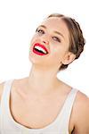 Cheerful model in white dress posing looking at camera on white background