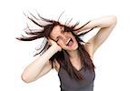 Furious pretty brunette on white background tossing her hair