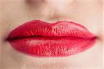 Extreme close up on sensual voluminous red lips