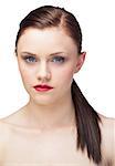 Unsmiling gorgeous model with ponytail posing on white background