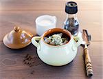 Fresh boiled meat dumplings served with dill in a pot