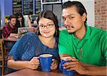 Young couple sitting in a coffee house