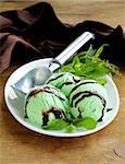 balls mint ice cream with fresh green herb