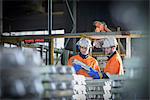 Warehouse workers checking aluminum ingots