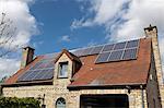 Detached house with solar panels on roof