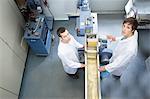 Elevated view of two scientists in technical laboratory