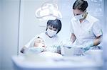 Dentist and nurse treating patient
