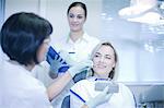 Dentist testing veneers on patient