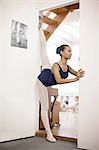 Portrait of teenage ballerina in doorway