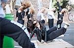 Group of girls breakdancing in carpark