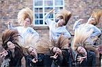 Group of girls practicing dance in carpark