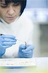 Dental technician working on false tooth