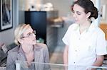 Nurse talking to hospital receptionist