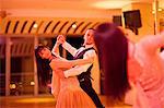 Young ballroom dancers practising in mirror