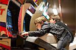 Two young brothers playing on driving video games