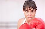 Portrait of mid adult woman in boxing gloves