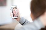 Young woman making video call on cellphone