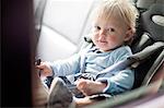 Baby boy in back seat of car