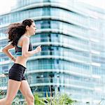 Young woman running in city