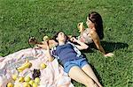 Two young females sharing a picnic