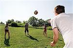 Group of young adults playing football