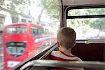 Young boy on double decker bus in London