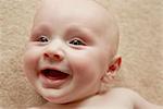 Close up of baby with wide smile