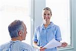 Nurse having conversation with patient