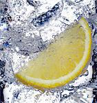 Fizzy lemon juice with ice cubes