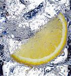 Fizzy lemon juice with ice cubes