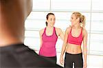 Women standing together in exercise class