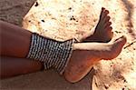 Close-up of feet and legs of Himba woman, Kaokoveld, Namibia, Africa