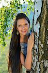 Portrait of Young Woman by Tree Trunk, Upper Palatinate, Bavaria, Germany