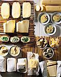 Assorted types of butter on straw mats