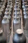 Rows of Metal Bottles with French Writing