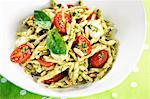 Strozzapreti pasta with pesto and cherry tomatoes