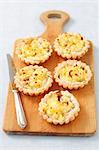 Puff pastry tartlets with camembert and potato mash