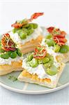 Puff pastry tartlets with ricotta, broad bean and fried ham