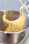 Cake batter on the dough hook of a food processor