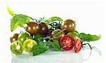 Green and red cherry tomatoes with water droplets