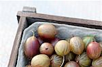 Gooseberries in a wooden crate