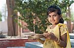 Girl praying in a temple, Sohna, Haryana, India