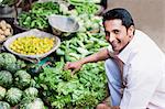 Man buying vegetables from a market stall, Sohna, Gurgaon, Haryana, India