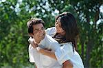 Man carried his girlfriend piggyback in a park, Japanese Park, Rohini, Delhi, India