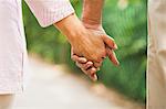Mature couple holding hands of each other, Lodi Gardens, New Delhi, India