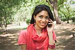 Woman talking on a mobile phone, Lodi Gardens, New Delhi, Delhi, India