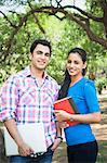 Friends standing in a park and smiling, Lodi Gardens, New Delhi, Delhi, India