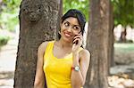 Woman talking on a mobile phone in a park, Lodi Gardens, New Delhi, Delhi, India